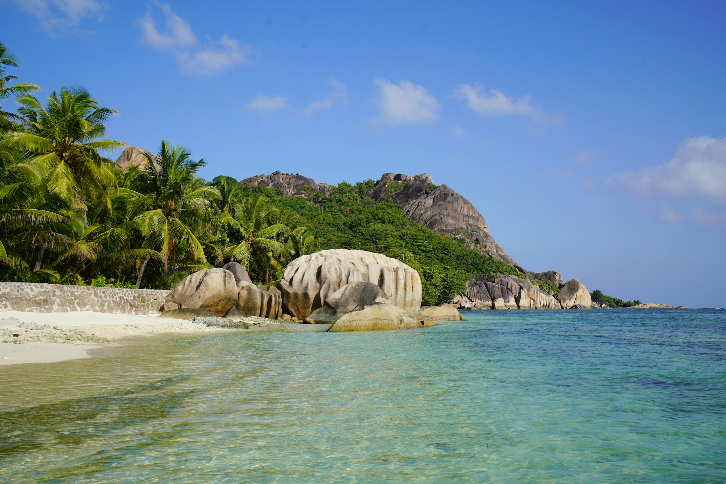 Granite boulders and turquoise water on La Digue, Seychelles